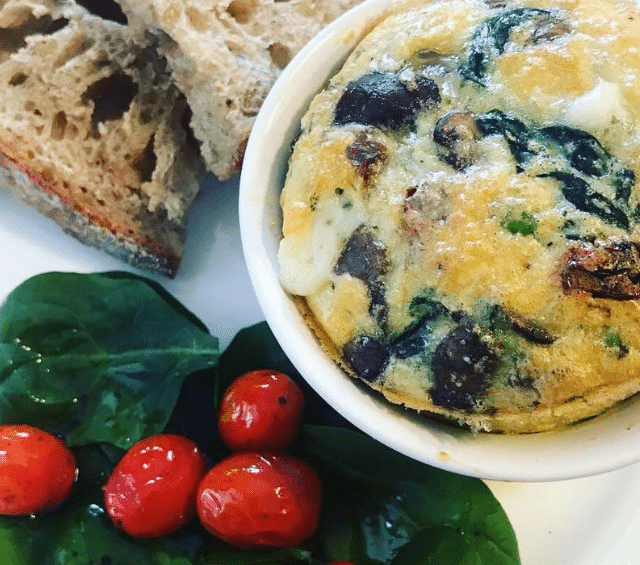 egg soufflé, spinach and tomato salad, fresh sourdough bread